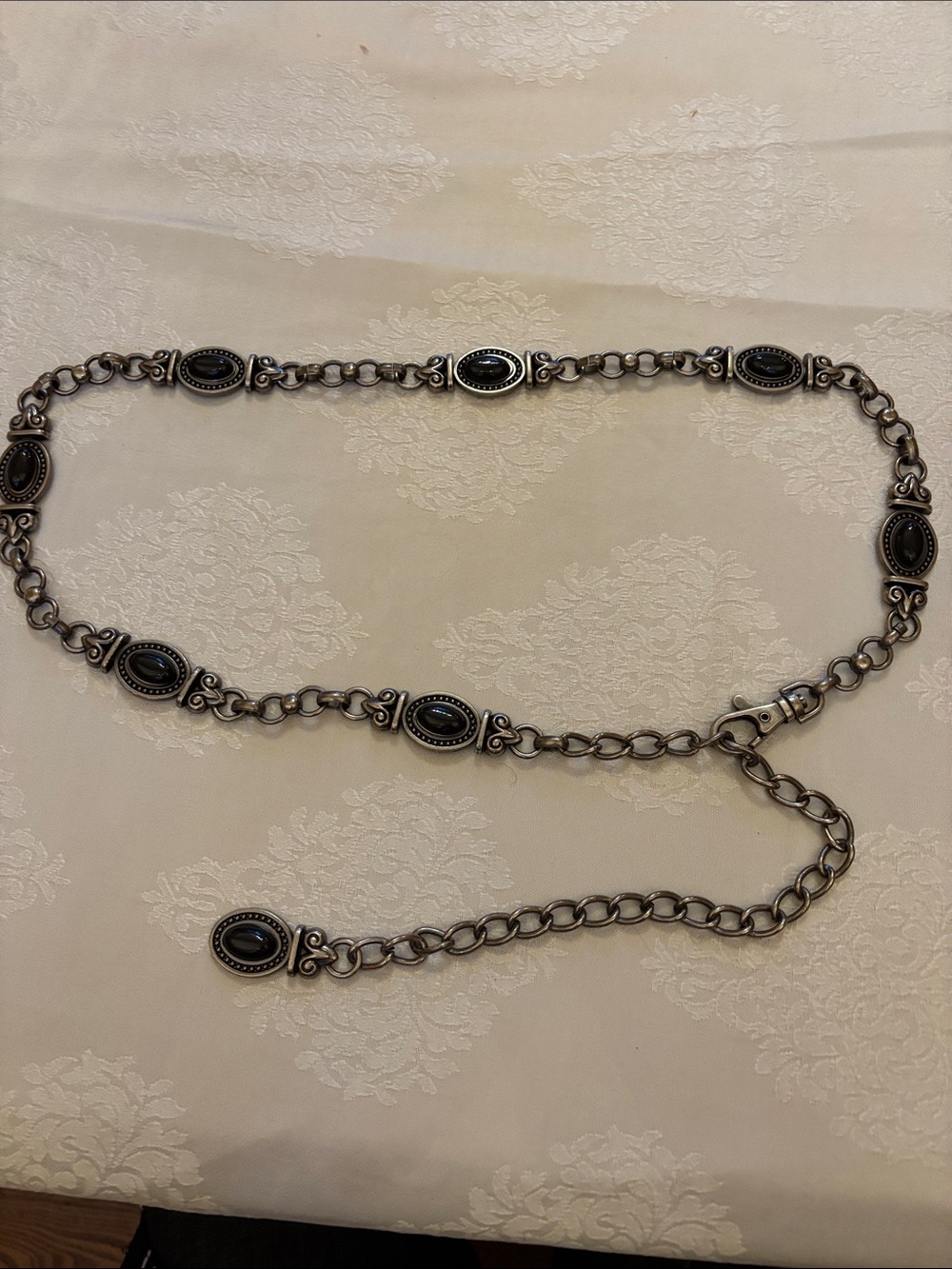 Silver metal belt with black cabouchons
